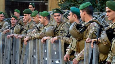 Lebanese army soldiers stand guard during a protest by retired members of security outside the government palace in Beirut last December. EPA