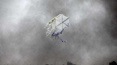 A kite flies over the border in an area where kites and balloons have caused blazes, between Israel and the Gaza strip June 8, 2018. Amir Cohen / Reuters