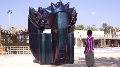 - A man looks at the public art installation Alien Technology by Monira Al Qadiri at the Shindagha Heritage Centre. Courtesy Clint McLean
