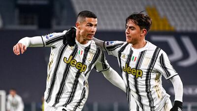 Juventus star Cristiano Ronaldo, left, celebrates scoring with teammate Paulo Dybala after scoring against Udinese. AP