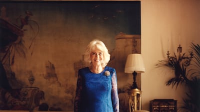 The queen consort, wearing a blue Bruce Oldfield gown, in photo taken for British Vogue at Clarence House for the magazine's July issue. AP