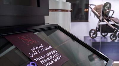 Touchscreens of navigation boards are disabled at Abu Dhabi's Al Wahda Mall. Victor Besa / The National