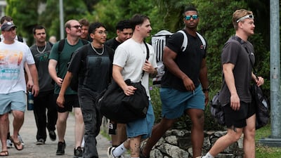 Members of the US military head for the hotel after disembarking. Reuters