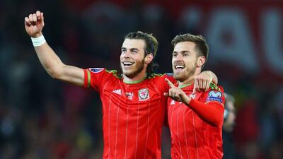 Gareth Bale and Aaron Ramsey of Wales celebrate victory after their final Euro 2016 qualifier on Tuesday night in Cardiff. Michael Steele / Getty Images