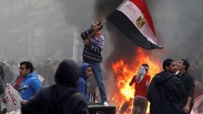 Egyptian protesters gather outside the parliament building during clashes with soldiers on Friday.