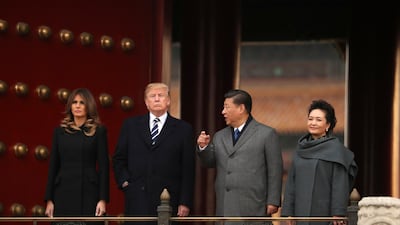 President Donald Trump, first lady Melania Trump, accompanied by Chinese President Xi Jinping and his wife Peng Liyuan tour the Forbidden City in Beijing, China. Andrew Harnik / AP Photo