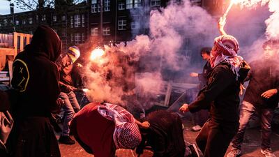 Pro Israeli protestors disrupt a protest by pro-Palestinian protesters gathering at the campus of the University of Amsterdam. AFP