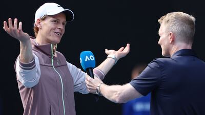 Italy's Jannik Sinner conducts his on-court interview after victory over Novak Djokovic. AFP