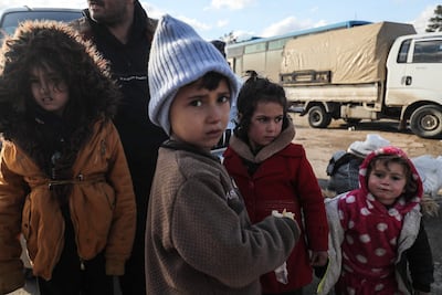 Kurdish families fleeing a government advance arrive in the city of Qamishli. AFP