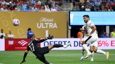 Ilkay Gundogan of Manchester City scores his team's fourth goal past Al Ain goalkeeper Khalid Essa. AFP