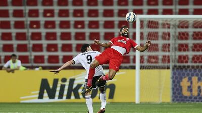 Al Ahli's Salmeen Khamis heads the ball against Nasaf in the Asian Champions League group game at the Rashid Stadium in Dubai. Sarah Dea / The National / March 18, 2015