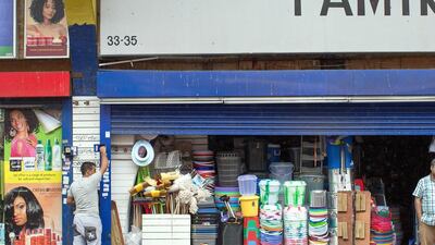 A man closes the shutter on his shop under Brixton Arches. Once regeneration work is done around 50 small businesses and up to 150 jobs are likely to be lost. Dan Kitwood / Getty