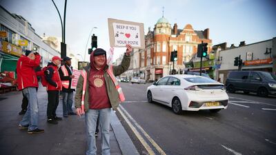 Postal workers on the picket line at the Kilburn Delivery Office in north west London in November. PA