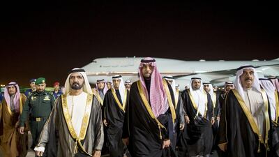 Sheikh Mohammed bin Rashid, Vice President of the UAE and the Ruler of Dubai, left, and Sheikh Saud bin Rashid Al Mu’alla, UAE Supreme Council Member and Ruler of Umm Al Quwain, right, are received by Majed bin Abdullah bin Abdulaziz, centre, upon their arrival in Riyadh. Also seen are Sheikh Mansour bin Zayed Al Nahyan, Deputy Prime Minister and Minister of Presidential Affairs, second row third left, and Sheikh Mohammed bin Hamad Al Sharqi, Crown Prince of Fujairah, second row right. Rashed Al Mansoori / Crown Prince Court - Abu Dhabi