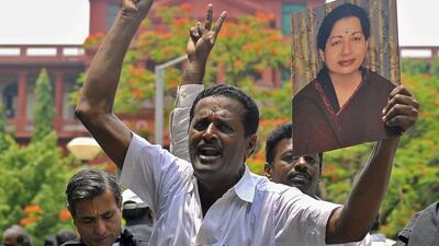 Lawyers from the Karnataka High Court hold a portrait of Jayalalithaa Jayaram, former chief minister of Tamil Nadu state and chief of her AIADMK party, during celebrations outside a court in Bengaluru on May 11. Reuters