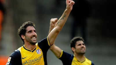 Atletico Madrid midfielder Raul Garcia celebrates his goal against Valencia on Sunday as Diego Costa celebrates with him in the background. Jose Jordan / AFP / April 27, 2014