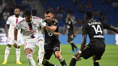 Lyon's Brazilian midfielder Lucas Paqueta fights for the ball with Ajaccio's French midfielder Thomas Mangani. AFP
