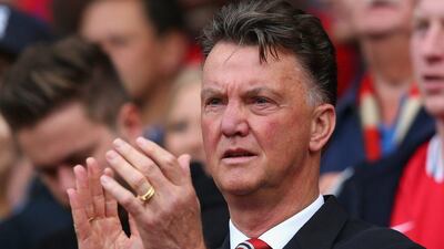 Manchester United manager Louis van Gaal applauds during his club's 4-0 victory over QPR in the EPL on Sunday. Alex Livesey / Getty Images
