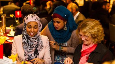 5:49pm - Tasneem arrives at the Australian Football League Ramadan Dinner and meets with her friend Toltu Tufa, founder of Afaan Publications.