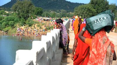 Indian Hindu pilgrims on the bridge where a deadly stampede took place the previous day near the Ratangarh temple in the Datia district of central Madhya Pradesh. Sajjad Hussain / AFP