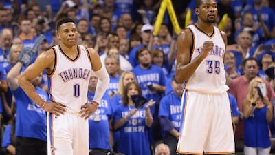 Oklahoma City Thunder players Kevin Durant, right, and Russell Westbrook react during their Game 6 win over the San Antonio Spurs in the NBA play-offs on Thursday night. Larry W Smith / EPA / May 12, 2016