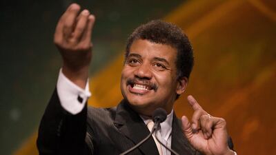 Neil deGrasse Tyson, director of the Hayden Planetarium, speaks during the 28th National Space Symposium in Colorado. Mr deGrasse Tyson addressed the World Government Summit in Dubai on Monday. Matthew Staver / Bloomberg
