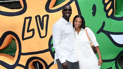 French actor Omar Sy and daughter Selly Sy attend the Louis Vuitton show. Getty Images For Louis Vuitton