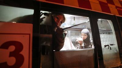 A child looks out of an ambulance during medical evacuations from eastern Ghouta to Damascus. Mohammed Badra / EPA