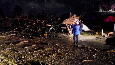 Photographing the damage. AP Photo