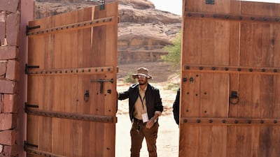 An employee opens the gate leading to the Sharaan Nature Reserve near the town of al-Ula in northwestern Saudi Arabia. AFP