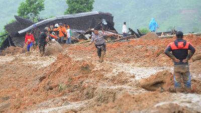 Indonesian villigers and rescuers search for landslide victims at Sirnaresmi village in Sukabumi, Indonesia. EPA