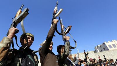 Supporters of the Houthi rebel movement hold up weapons during a rally in the capital, Sanaa. EPA