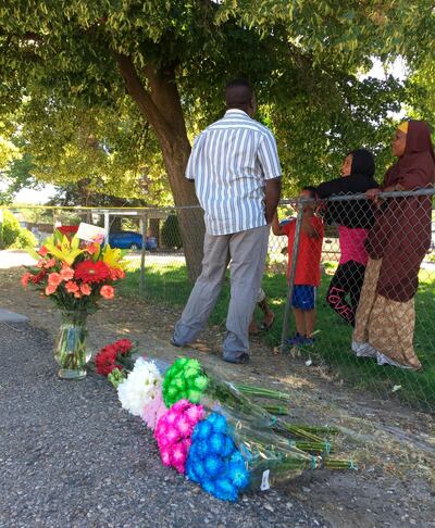 Flowers from well-wishers are left just outside a Boise, Idaho, apartment complex, on July 1, 2018, where nine people were stabbed in a knife attack the night before. Rebecca Boone / AP