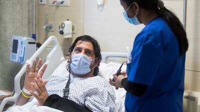 Doctors removed shrapnel from Mr Khan's left shoulder.