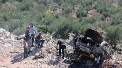 A burnt-out car in Qarawa in the occupied West Bank, where attacks by illegal Israeli settlers on Palestinians are on the rise. EPA