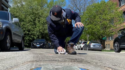 Chicago artist Jim Bachor creates four pandemic-themed pothole mosaics on the city's North Side, during the coronavirus disease outbreak in Chicago, Illinois, USA. Reuters
