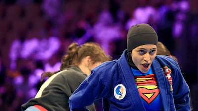 The UAE's Reem Al Falahi, in blue, defeated Lauren Martin of the United States for the juvenile 61.5 kilograms blue belt division gold, her last event before moving to women’s open class . Ravindranath K / The National