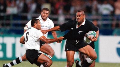 Jonah Lomu pushes aside Fijian captain Serevi Waisale during their Commonwealth Games match in Kuala Lumpur, Malaysia on 14 September 1998. Darren McNamara / EPA