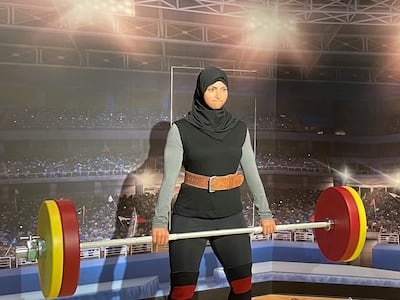 Visitors can weight lift alongside Amna Al Haddad at Madame Tussauds Dubai. Janice Rodrigues / The National