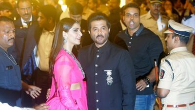 Bollywood actor Anil Kapoor and his daughter Sonam Kapoor arrive to attend the wedding. AP Photo