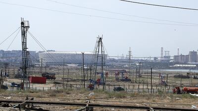 But Baku has a long fossil fuel history, with oil derricks seen here and the stadium in the background
