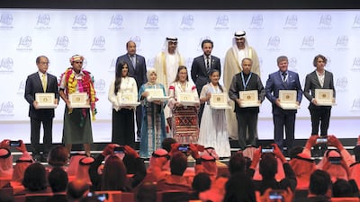 Sheikh Mohammed bin Zayed with the winners at the Zayed Future Energy Prize awards ceremony as part of Abu Dhabi Sustainability Week. Chris Whiteoak / The National