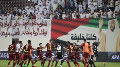 Al Wahda celebrate after beating Al Ain in their Arabian Gulf League match at Abu Dhabi on Saturday night. Adil Alnaimi / Al Ittihad