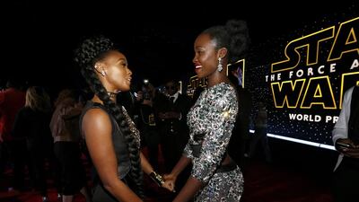 Actress Lupita Nyong’o, right, and singer Janelle Monae chat as they arrive at the premiere of Star Wars: The Force Awakens. Mario Anzuoni / Reuters
