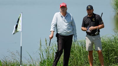 Mr Trump and professional golfer Graeme McDowell. Reuters