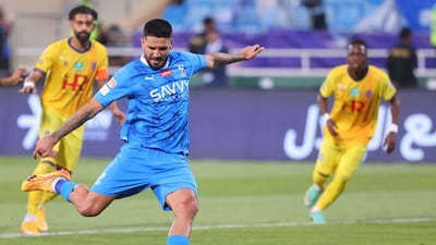 Aleksandar Mitrovic scores Hilal's first goal from the penalty spot. AFP