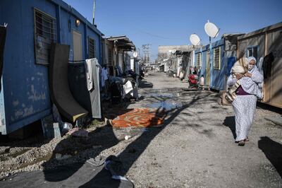A woman carries her baby at Eleonas refugee camp in Athens, Greece. AFP
