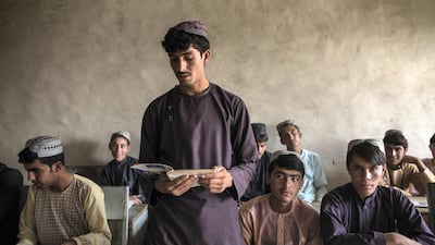 Khalil, 20, stands in the school building he constructed three years ago in Afghanistan's Kandahar province. Stefanie Glinski for The National