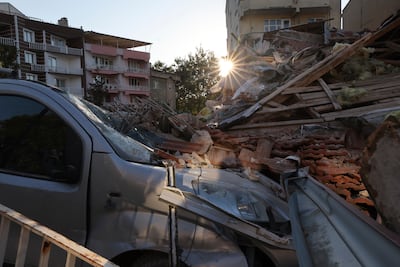 Rubble from the earthquake destroyed a car in Sindirgi. AP
