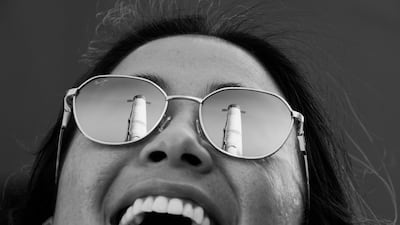 The US pavilion is reflected in a visitor's sunglasses. Photo: Expo 2020 Dubai